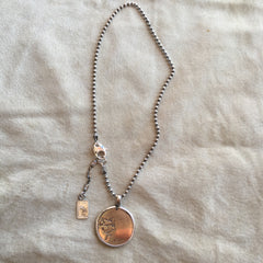 HEADS OR TAILS NECKLACE